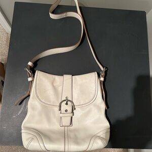 Coach Leather Soho Shoulder Bag with adjustable strap.